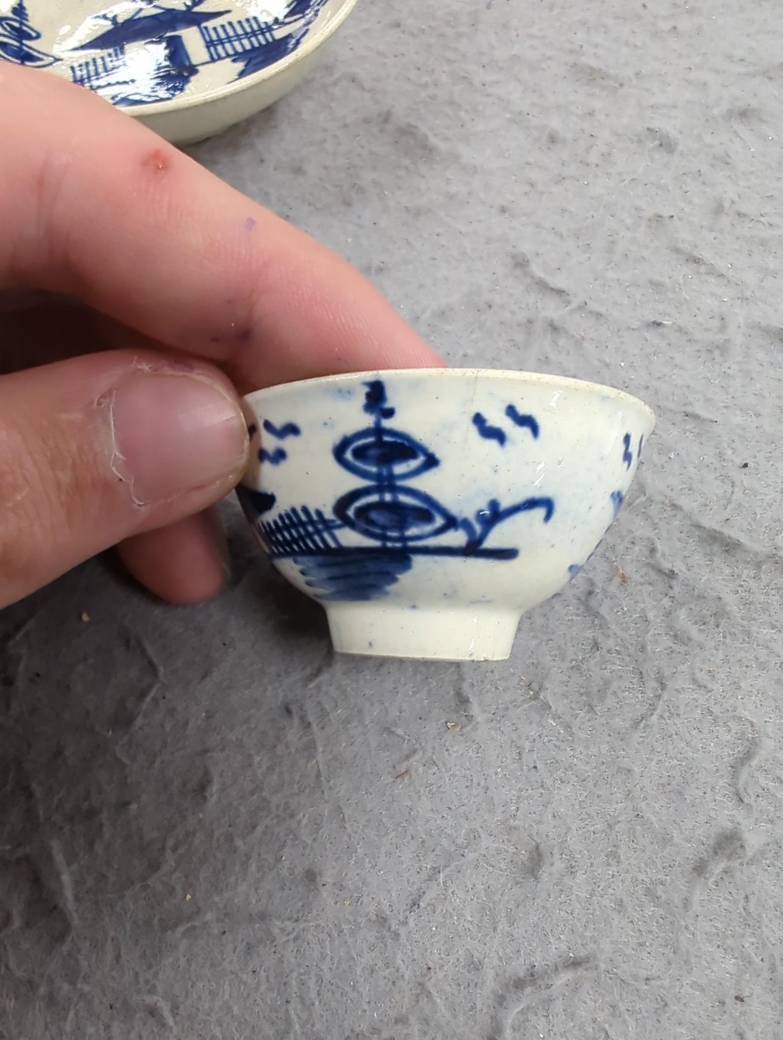 A late 18th century pearlware blue and white miniature jug, 5cm, and tea bowl and an English porcelain miniature mug, late 18th century